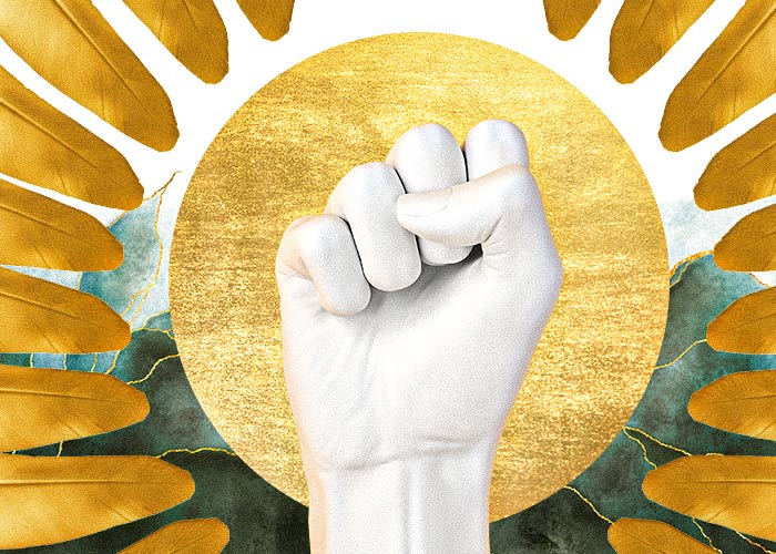 a fist against gold background symbolizing the cusp